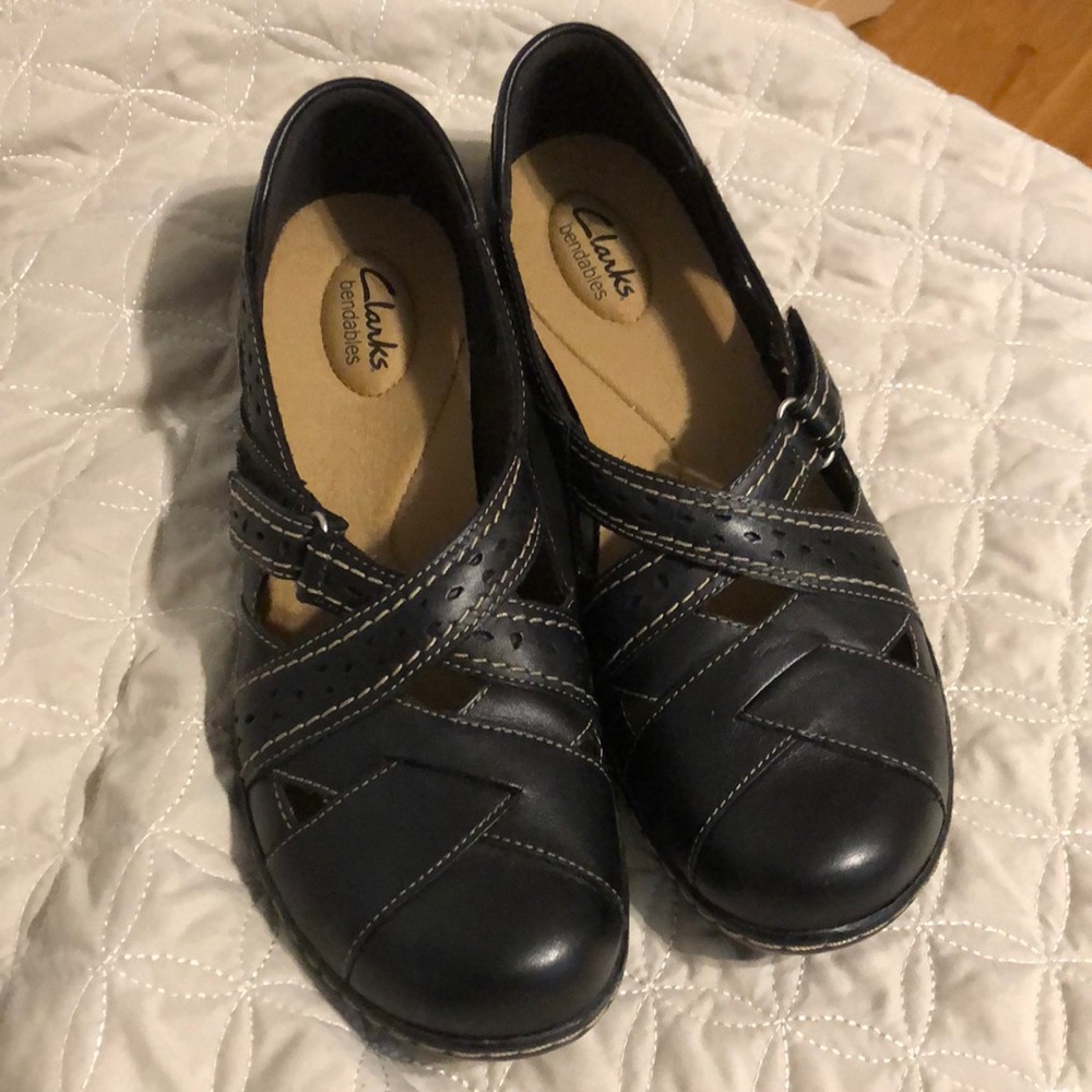 Clark’s black leather flats